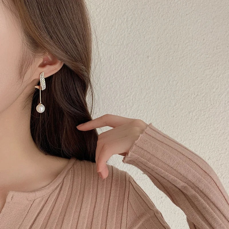Lily – Curved Earrings with Dangling Pearl - Image 3